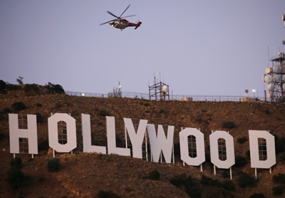 Six held after Tinseltown's famous sign changed to 'Hollyboob'