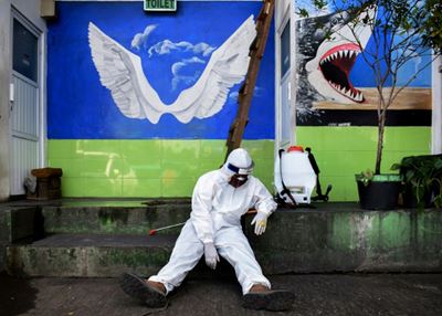 WHO warns virus may be here to stay as toll nears 300,000