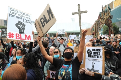 New Zealand PM chides marchers over virus rule breach