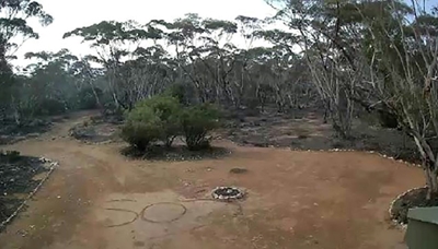 'SOS' picked up on CCTV saves Aussie woman lost in bush