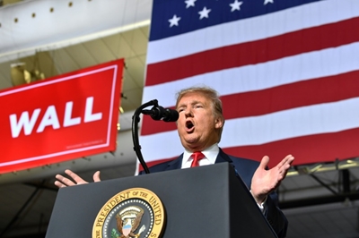 Trump says not 'happy' with border deal but shutdown unlikely