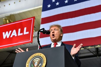 Trump says not 'happy' with border deal but shutdown unlikely