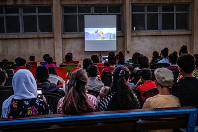 Mobile cinema brings movie magic to Syria Kurd children