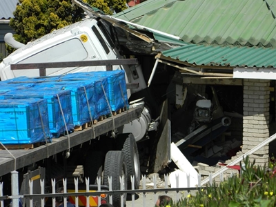 Truck crashes into PetroSA building