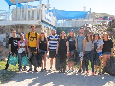 Groups join hands in beach clean-up