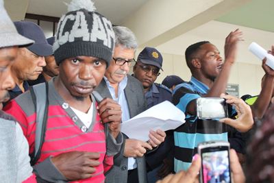 Angry protesters demand land and services