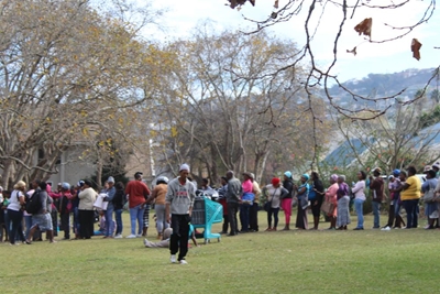 Queues of people line up to get donations