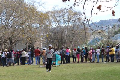Queues of people line up to get donations