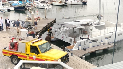 Waterfront catamaran fire contained