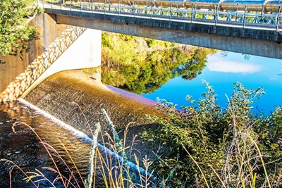 Dam overflows, 'but please keep saving'
