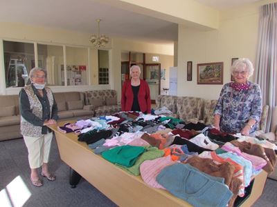 Knitting needles clicking for the needy