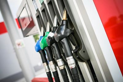 Battered currency pushes fuel higher