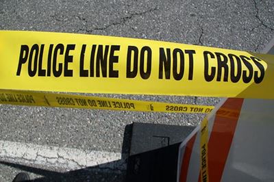 Man drives into fence, found dead behind wheel