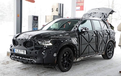 Camouflaged baby Volvo XC spied again
