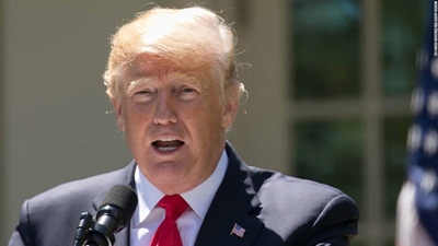 Back on stage, Trump airs conspiracies and flirts with 2024 run