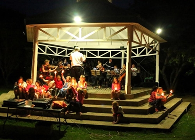 Orchestra and voices blend for carol-singing