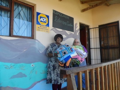 Coordinator hands over blanket project
