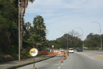 Lane still closed after collapsed slope