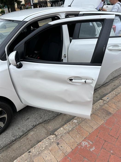 Woman escapes with her life after a cow charges her car