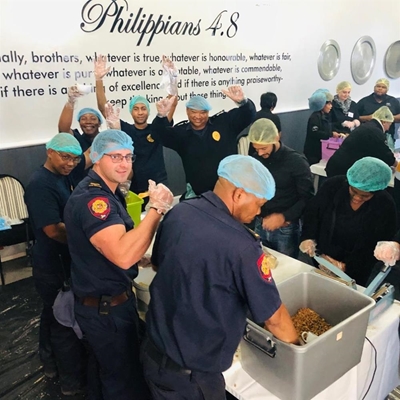 Firefighters swap helmets for hairnets