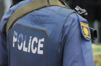 Naked man hits police officer over the head with a brick