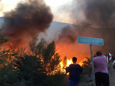 Fire rages in river