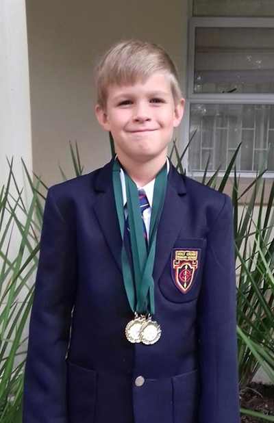 Caleb a champion swimmer