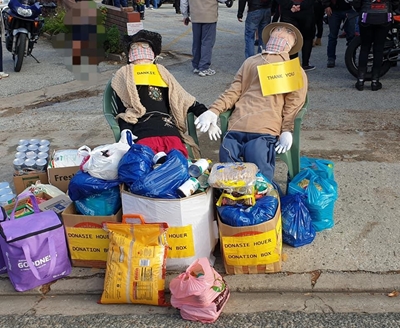 Bikers donate food to the elderly
