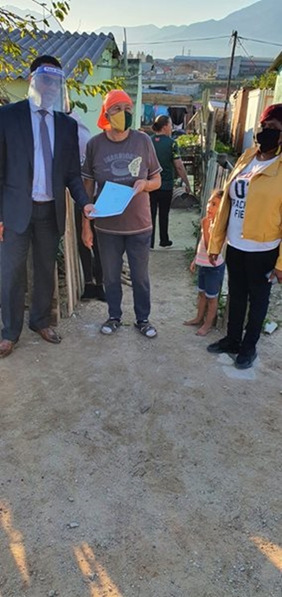 New homeowners receive their title deeds from Simmers