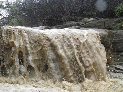 River branches in flood after much-needed rain