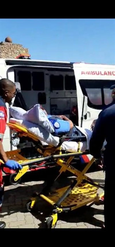 Taxi drives into two traffic officials