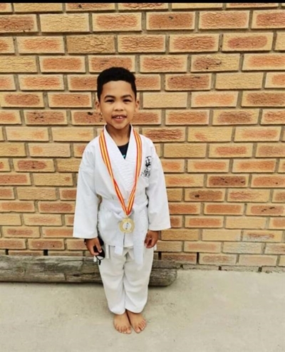Help young karate kid fight for his dream in Italy