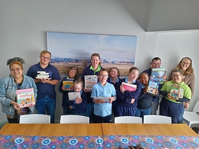 Up With Downs donates books to Options 