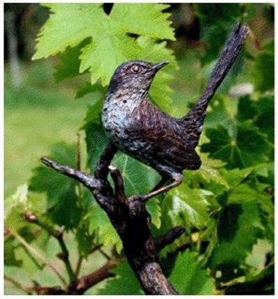 Bronze sculptures among roses
