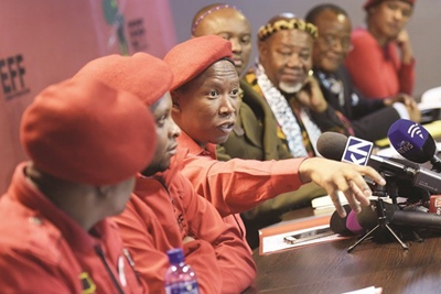 Malema stands behind Floyd Shivambu