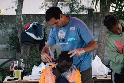 A street shower of blessings for the homeless