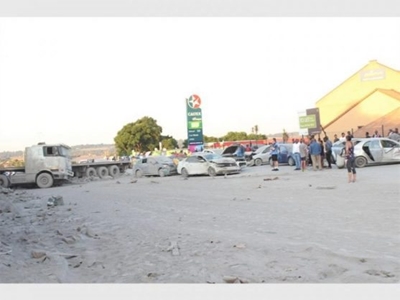 Truck with 700 bags of cement ploughs into 17 cars
