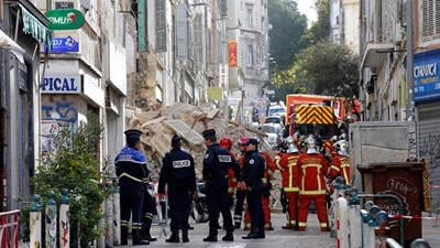 Rescuers search for victims after buildings collapse in Marseille