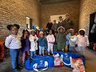 Amy Bell kids receive blue bags full of goodies