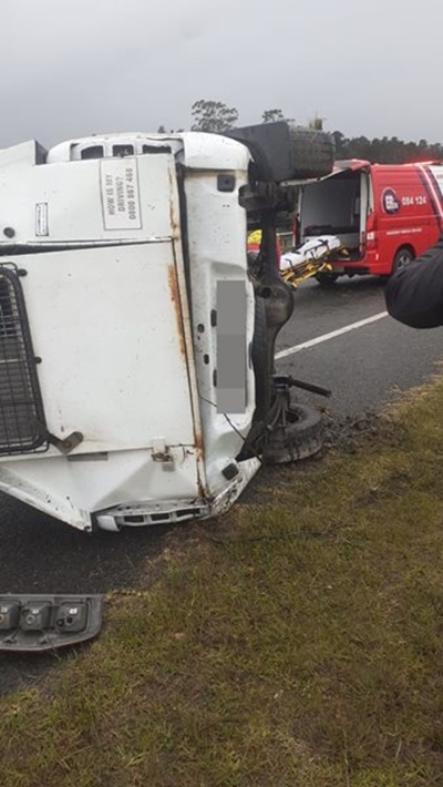 Bakkie carrying prisoner flips on N2