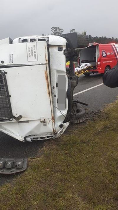 Bakkie carrying prisoner flips on N2