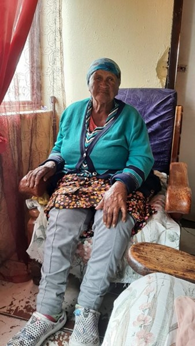 90-year-old woman signs transfer for her house 