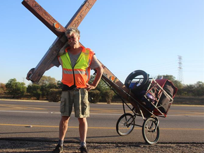 North West man with the cross walks to Zimbabwe