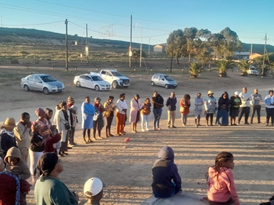 Church leaders and community members gather to pray