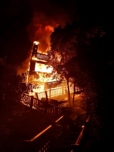 Wilderness home goes up in flames