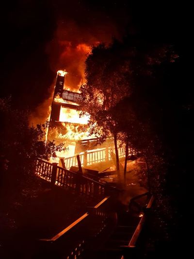 Wilderness home goes up in flames