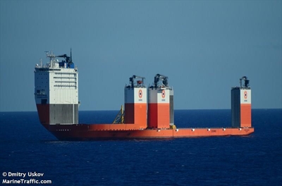 Heavy load carrier passes by Wilderness