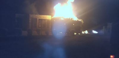 Four arrested after community sets man accused of wife’s death alight