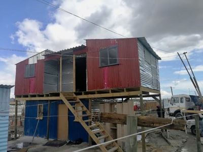 Land occupiers take over Cape Town sports field. Now building double-storeys