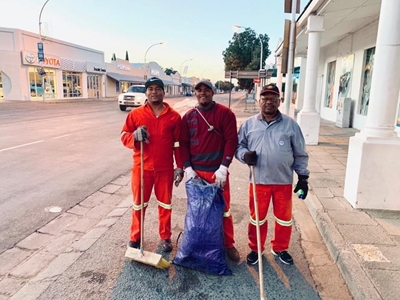 Street cleaners sweep with a smile